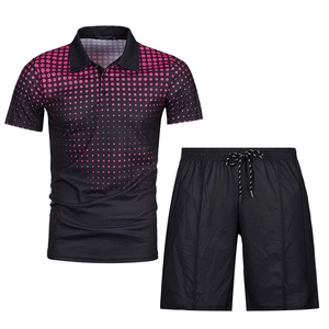 Detail of men's black polo shirt fabric texture with pink gradient dots and drawstring shorts