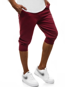 Dettaglio dei pantaloni sportivi bordeaux da uomo in morbido tessuto a maglia con polsini