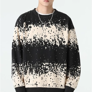 Men's loose knit sweater featuring unique black and white pixelated gradient stripes