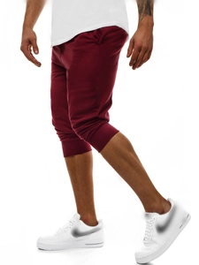 Dettaglio dei pantaloni jogger da uomo bordeaux con polsini a costine e cotone morbido