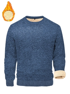 Detail view of thickened beige fleece lining and ribbed cuff on blue men's sweater