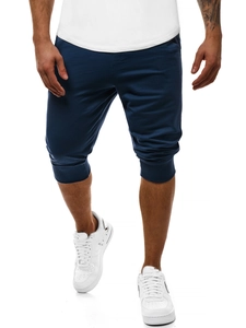 Dettaglio del polsino elastico e del tessuto slim fit dei joggers blu scuro da uomo