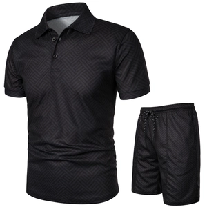 Detail of men's black polo set with geometric jacquard texture and drawstring shorts