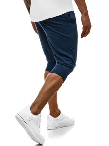 Dettaglio dei pantaloni jogger blu navy da uomo con taglio slim e polsini a costine