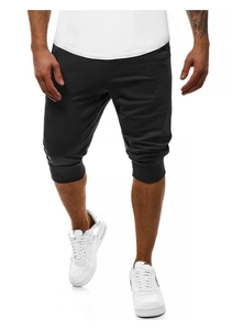 Dettaglio dei pantaloncini sportivi neri da uomo con polsini elastici e tessuto a maglia