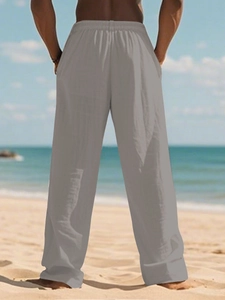 Rear view of men's grey linen pants featuring a comfortable elastic waist and beach style