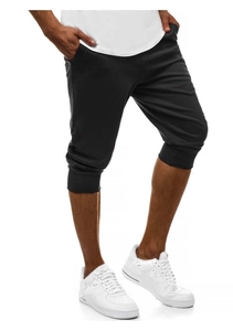 Dettaglio dei pantaloni jogger neri da uomo con polsini elastici e design slim fit