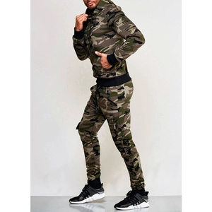 Detail of men's camouflage tracksuit featuring zip pockets and ribbed cuff design