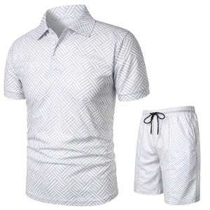 Detailed view of men's polo set with grey 3D geometric pattern and drawstring shorts