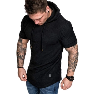 Detail of men's black hooded t-shirt showing drawstring hood and curved hem design