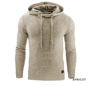 Detail of apricot jacquard knit hoodie featuring textured grid pattern and drawstring hood