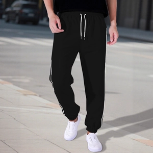 Men's black streetwear joggers with side stripes and elastic waist for urban sports look