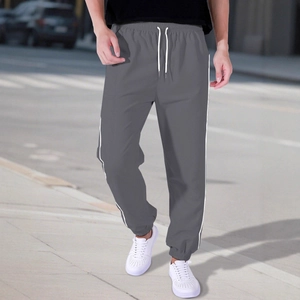 Men's grey high street jogger pants with white side stripes and drawstring waist design