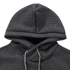 Close-up of dark grey waffle texture fabric and drawstring on the men hoodie neckline