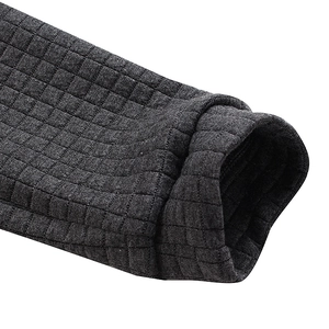 Close-up of deep charcoal waffle knit cuffs on a heavy men's hooded sweatshirt