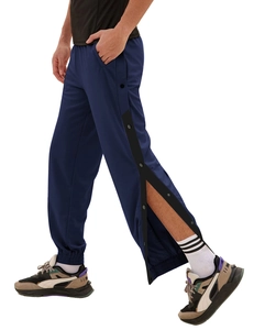 Detail of men's navy blue tearaway track pants with side snaps and elastic cuffs