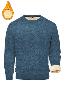 Detail view of navy blue knit sweater featuring warm faux shearling lining and ribbed cuffs