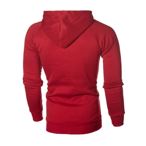 Detail view of the back of a red fleece hooded sweatshirt with ribbed hem and cuffs