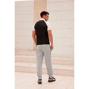 Men's loose snap button basketball pants with side stripes and elastic cuffs