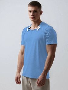 Detail of light blue adaptive surgery recovery shirt with metal snaps and trim
