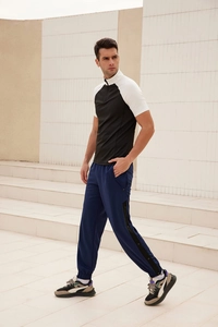 Men's loose track pants with side buttons and matching short-sleeve zip jacket set