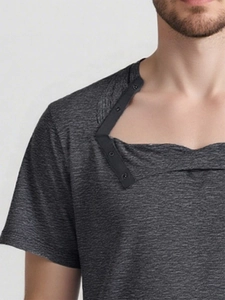 Detail of grey adaptive surgery recovery shirt with shoulder snaps and button placket