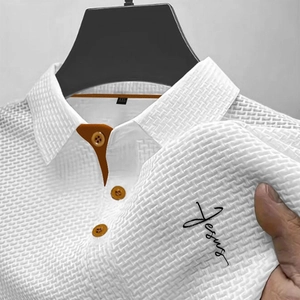 Close-up of white waffle mesh fabric polo shirt with orange collar and Jesus print