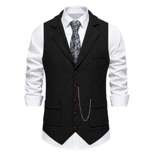 Detail of grey herringbone vest with notched lapel and decorative metal chain