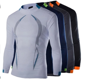 Detailed stack of men's athletic compression shirts in white, navy, gray, and black