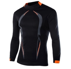 Detail of black sports compression long sleeve with orange stitching and geometric pattern