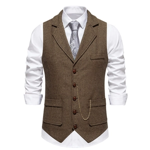Detail of vintage brown herringbone vest showing lapels, five buttons and metal chain