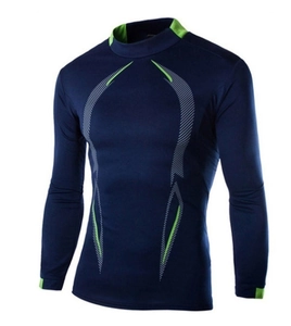 Detail of navy compression shirt featuring breathable fabric and neon green geometric lines