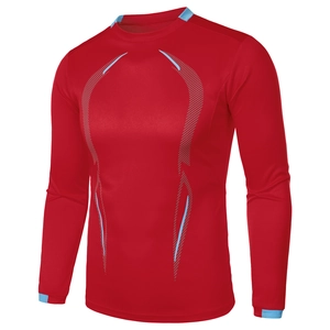 Detail of red athletic compression shirt with breathable mesh fabric and blue accents