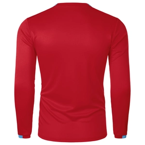 Detail of red long-sleeved athletic shirt featuring breathable honeycomb mesh and blue accents