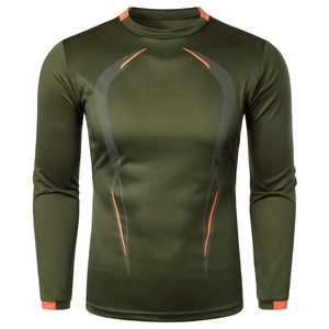 Detail of army green compression shirt showing orange stitching and breathable fabric