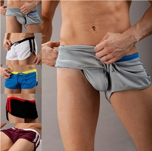 Detail of breathable mesh fabric on men's sports shorts with drawstring and stripes