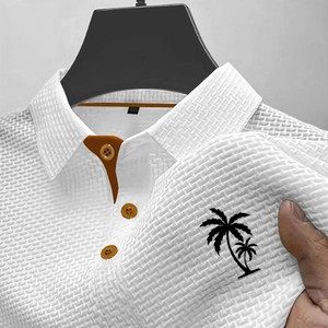 Polo homme blanc en soie glacée à motif palmier avec détails contrastés oranges