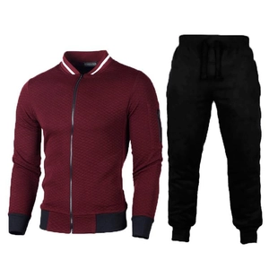 Detailed macro view of burgundy quilted jacket with white striped collar and black joggers
