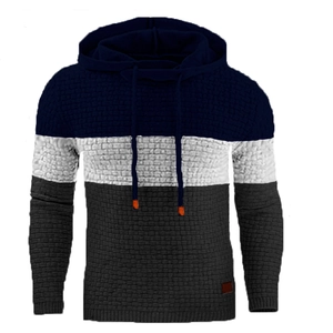 Detail view of the waffle knit fabric and color block design on the men's hoodie