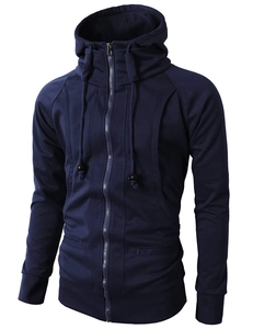 Close-up of navy sports hoodie featuring jacquard texture and high-collar zip detail