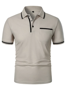 Detail of piqué fabric texture and contrast black trim on men's beige polo shirt pocket