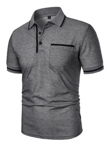 Close-up of grey polo shirt with textured fabric, breast pocket and contrast stripe trim