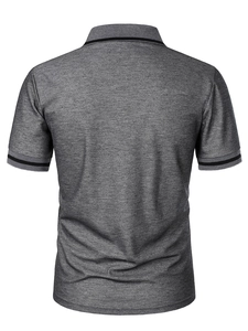 Detail of dark grey melange polo shirt showing athletic striped collar and back tailoring