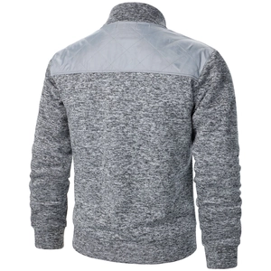 Rear view of men's knitted cardigan featuring grey quilted patchwork and ribbed hem
