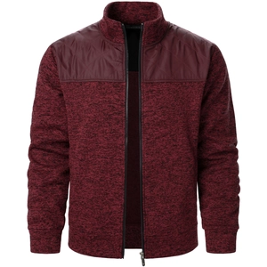 Close-up of men's burgundy zip cardigan with quilted shoulder detail and ribbed cuffs
