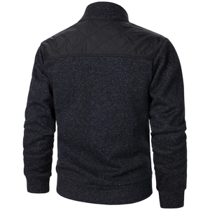 Rear view of men's knit cardigan with black diamond quilted nylon back and ribbed hem