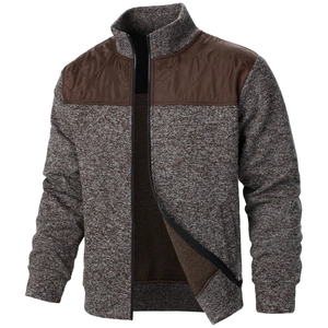 Detail of men's zip-up knit cardigan with brown quilted shoulder panels and stand collar