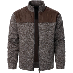 Detail of men's zip-up cardigan with brown quilted shoulder patches and knit texture