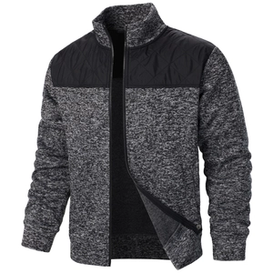 Detail of grey knitted cardigan featuring black diamond quilted shoulder patches and zipper