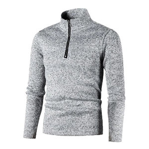 Detail shot of men's quarter-zip sweater showing grey marl knit texture and high collar